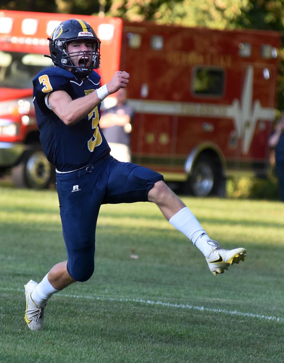 Cole Giesige of Whiteford celebrates after scoring his first touchdown over Ida Thursday, September 2, 2021.