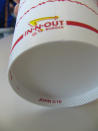 <div class="caption-credit"> Photo by: Getty Images</div>It may not be part of its logo, but In-n-Out Burger offers a subliminal message with every order by incorporating a tiny reference to a biblical verse on its packaging. Cups get John 3:16, which is, "For God so loved the world, that he gave his only Son, that whoever believes in him should not perish but have eternal life." <br>