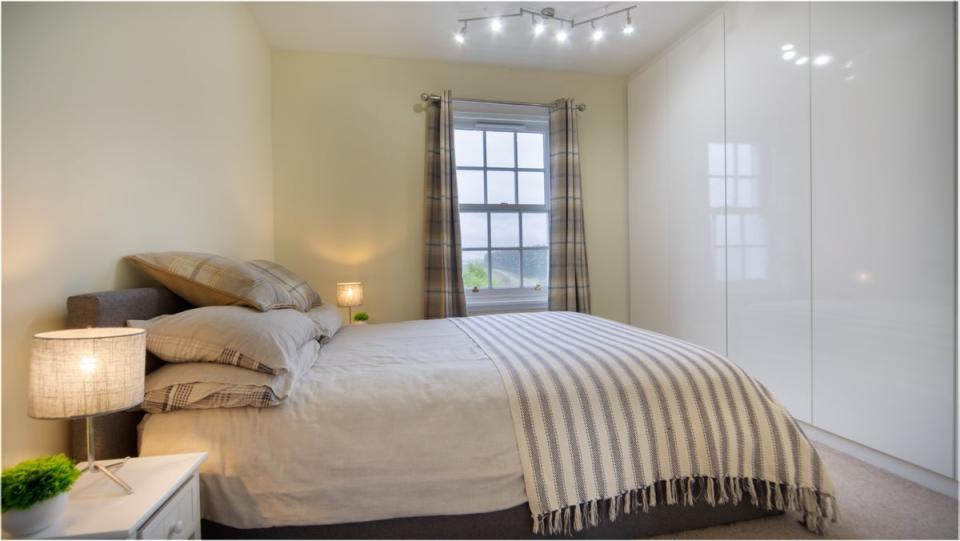 One of the cottage’s three bedrooms has views across the Scottish countryside (Yopa)