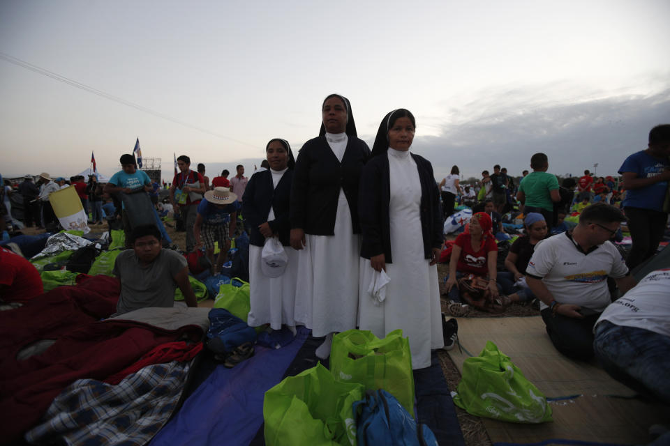 Nuns stand in the metro park Campo San Juan Pablo II, in Panama City, Sunday, Jan. 27, 2019, where Pope Francis will celebrate an early morning Mass. Francis is wrapping up his trip to Central America Sunday with a final World Youth Day Mass and a visit to a church-run home for people living with AIDS. (AP Photo/Rebecca Blackwell)