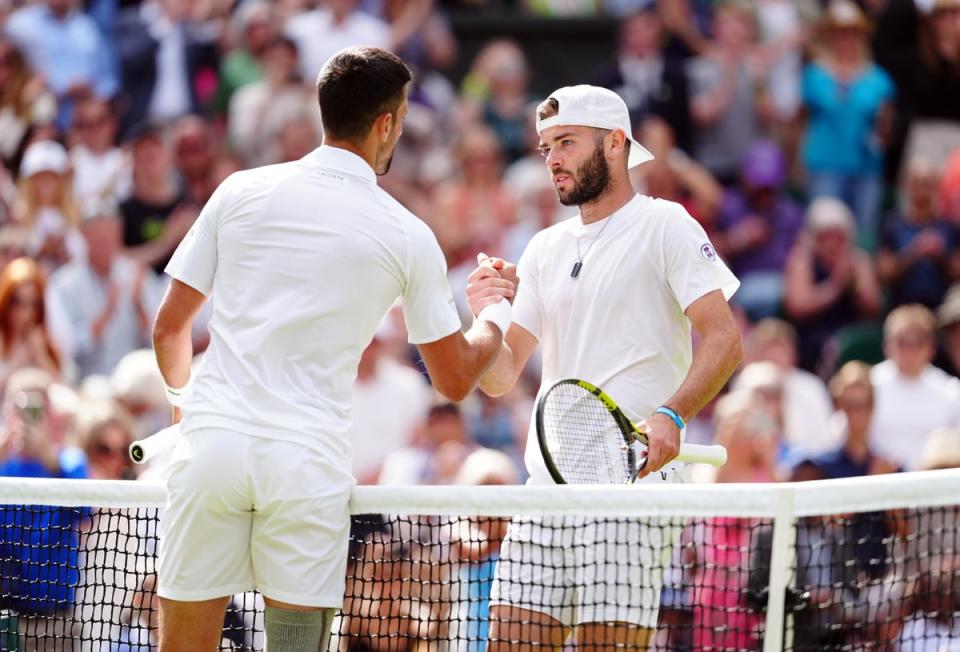 Jacob Fearnley (right) fell short of a seismic shock against Novak Djokovic (Mike Egerton/PA)