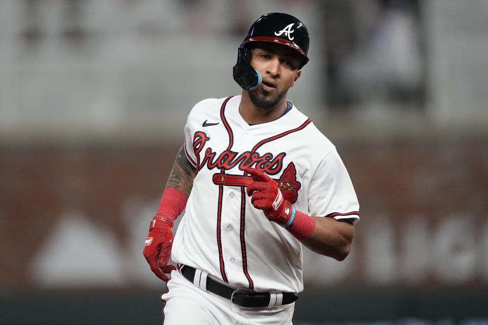 Atlanta Braves' Eddie Rosario runs the bases after hitting a home run against the Cincinnati Reds during the eighth inning of a baseball game Wednesday, April 12, 2023, in Atlanta. (AP Photo/John Bazemore)