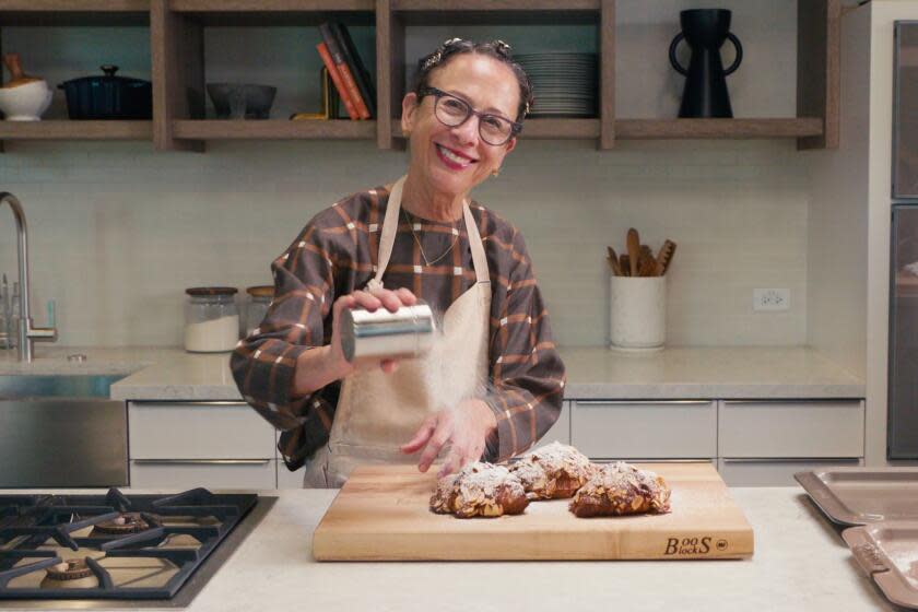 Nancy Silverton dusts croissants with powdered sugar