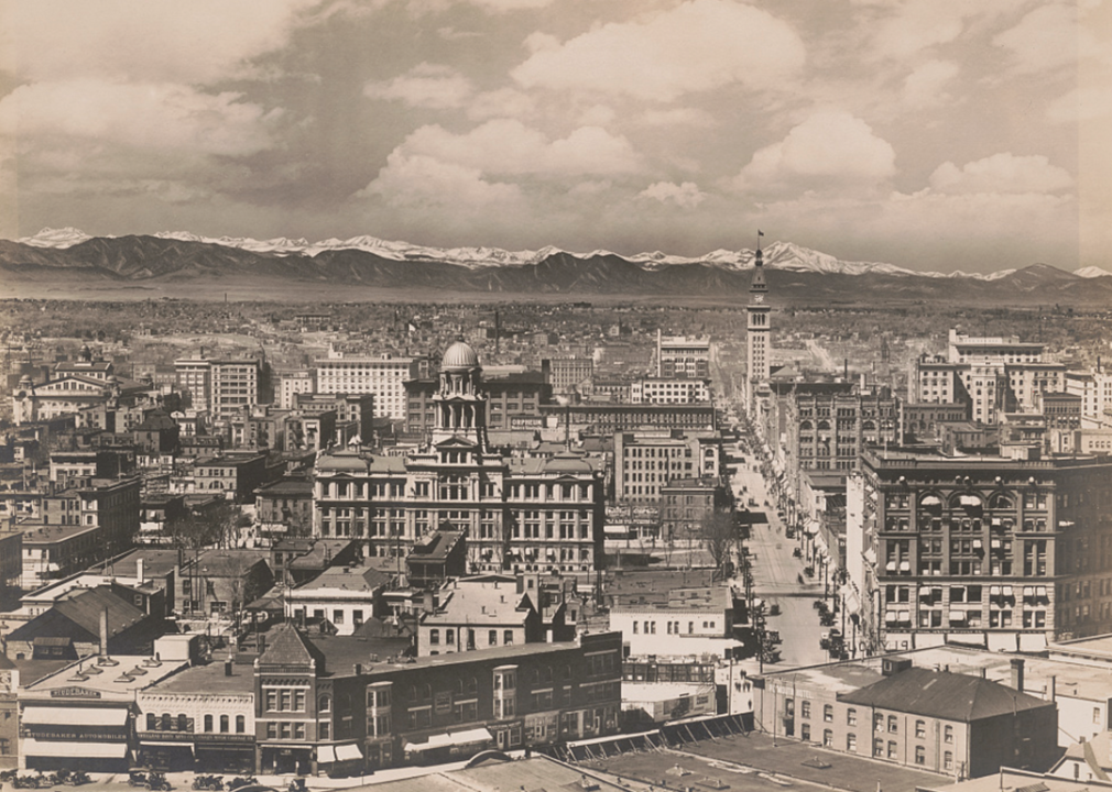 Panoramic view of downtown Denver with Daniels and Fisher Tower and mountains.