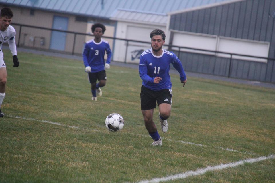 Perry's Sergio Sanchez chases down the ball on Monday, April 1, 2024, at Dewey Field.