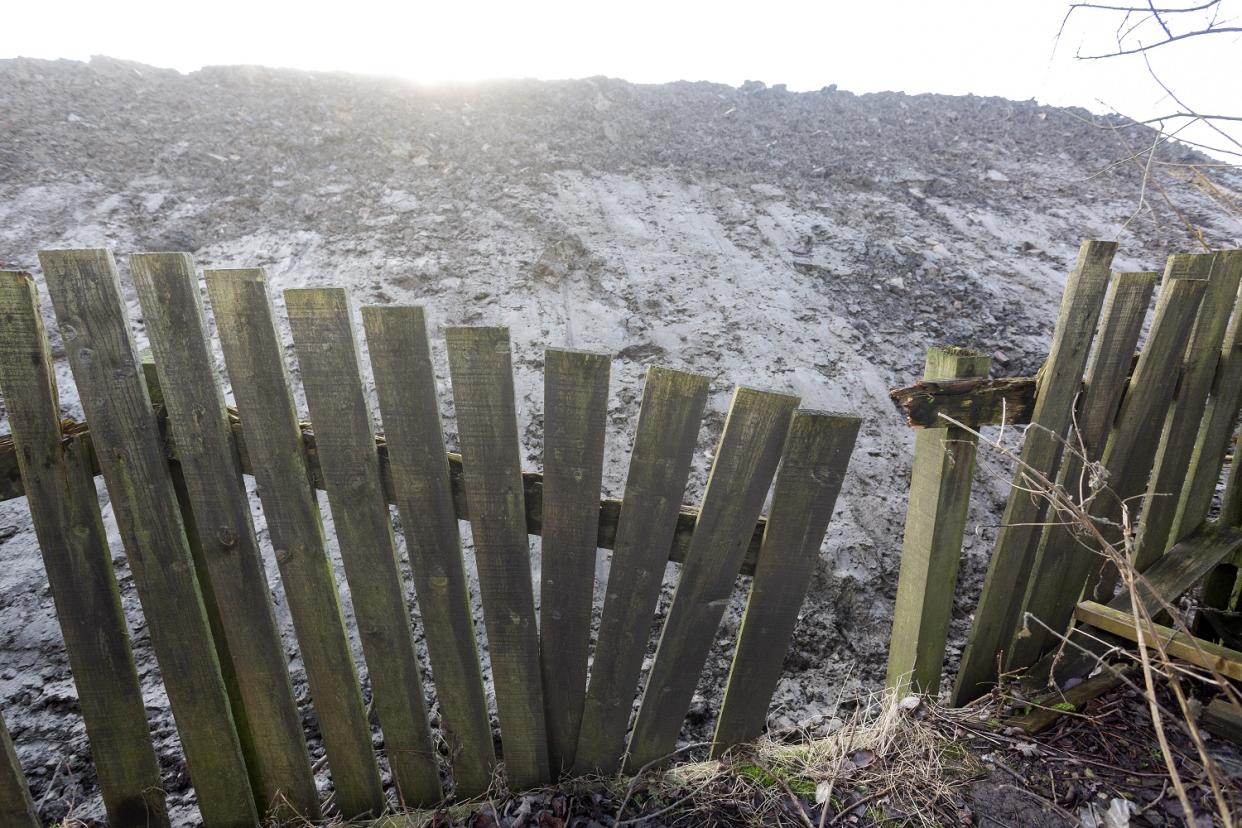 The mound has obscured the view of residents whose homes back onto the site in Lower Darwen.