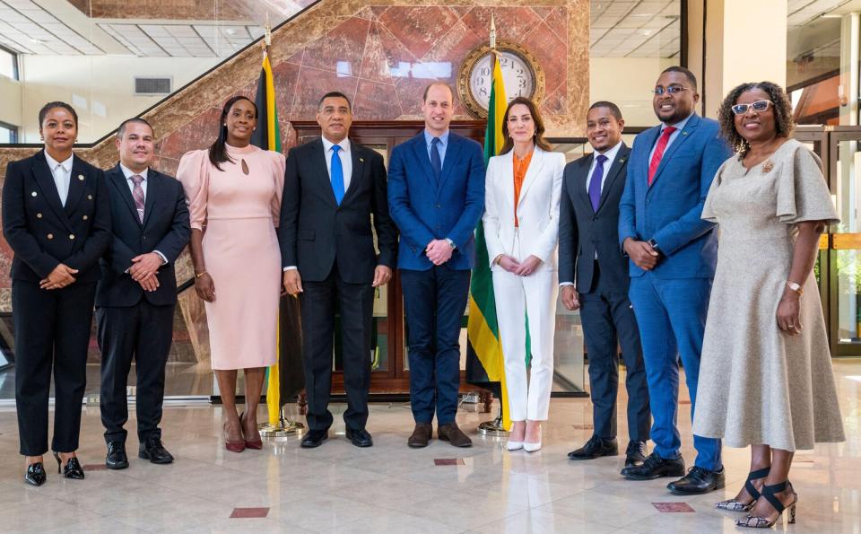 The Prime Minister of Jamaica, Andrew Holness (fourth left) his wife Juliet (third left) and government ministers with the Duke and Duchess of Cambridge during a meeting at his office in Kingston