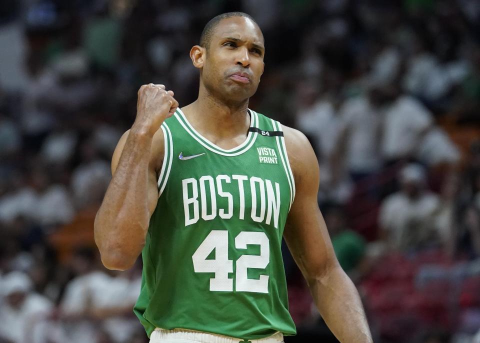 Boston Celtics center Al Horford (42) gestures after scoring a point during the second half of Game 2 of the NBA basketball Eastern Conference finals playoff series against the Miami Heat, Thursday, May 19, 2022, in Miami. (AP Photo/Lynne Sladky)