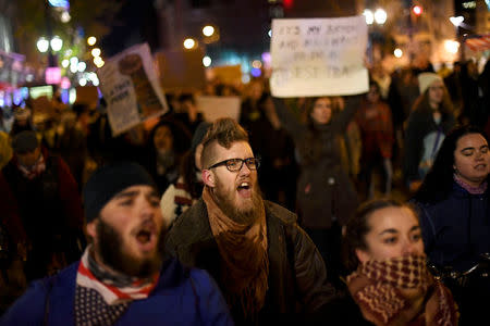 Demonstrators protest in response to the election of Republican Donald Trump as the president of the United States in Philadelphia, Pennsylvania, U.S. November 11, 2016. REUTERS/Mark Makela