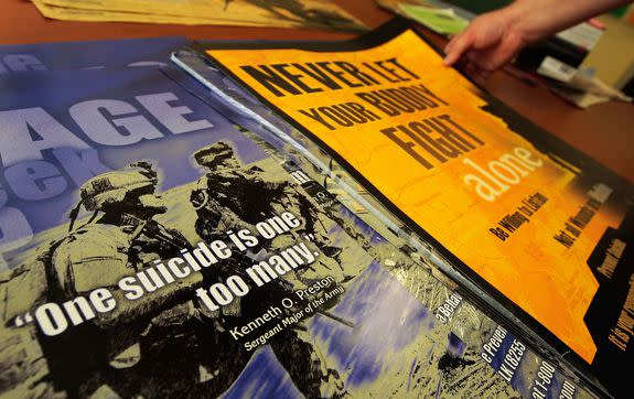 Posters are shown outside the Army's Suicide Prevention Program in Fort Riley, Kansas, 2009.