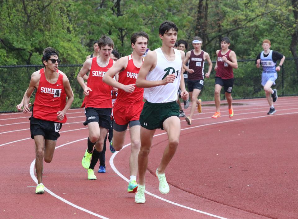 Theo Lynch from Pleasantville, right, placed first as athletes compete in the boys 3000 Meter Steeplechase during the Gold Rush Invitational Track & Field meet at Clarkstown South High School in West Nyack, April 29, 2023. 