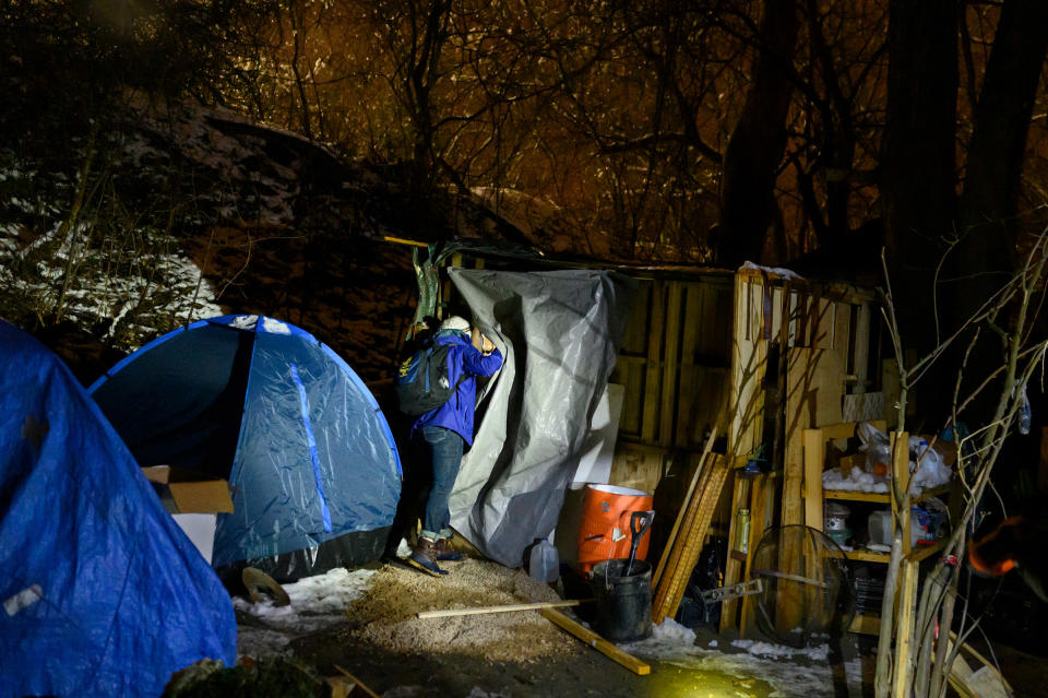 Nurse Crystal Bauer checks on a resident at a homeless encampment on Dec 18. Bauer helped start Project Hope, a street-medicine program supported through community donations.<span class="copyright">Rebecca Kiger</span>
