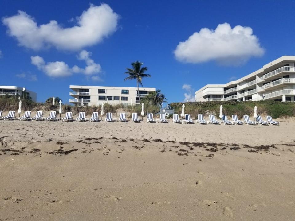 The Dorchester condominium in Palm Beach offers lounge chairs for residents. Twenty of the blue-and-white striped loungers were swept to sea Feb. 6 by strong surf that caused erosion along the beach.