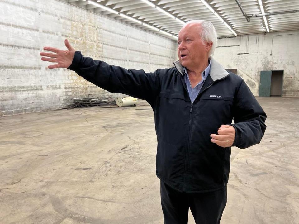 Ted Swaldo stands inside the former warehouse of the Ziegler Tire building in downtown Canton. The property will become the new home of the EN-RICH-MENT Fine Arts Academy.