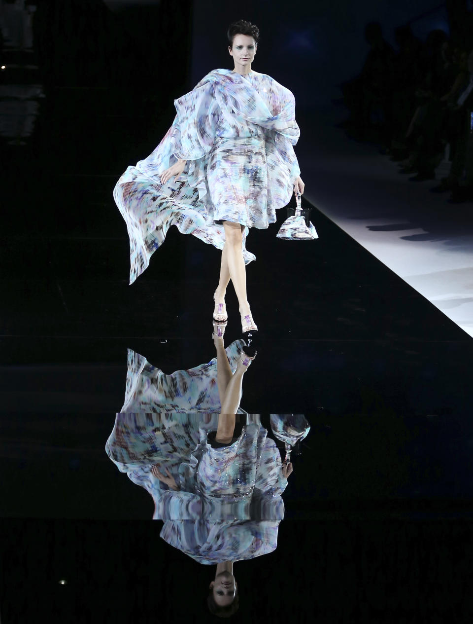 A model wears a creation for Giorgio Armani's women's Spring-Summer 2014 collection, part of the Milan Fashion Week, unveiled in Milan, Italy, Monday, Sept. 23, 2013. (AP Photo/Antonio Calanni)