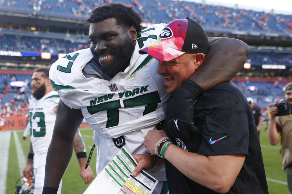 DENVER, COLORADO – OCTOBER 08: Mekhi Becton #77 and offensive coordinator Nathaniel Hackett of the New York Jets celebrate after beating the <a class="link " href="https://sports.yahoo.com/nfl/teams/denver/" data-i13n="sec:content-canvas;subsec:anchor_text;elm:context_link" data-ylk="slk:Denver Broncos;sec:content-canvas;subsec:anchor_text;elm:context_link;itc:0">Denver Broncos</a> 31-21 at Empower Field At Mile High on October 08, 2023 in Denver, Colorado. (Photo by Justin Edmonds/Getty Images)