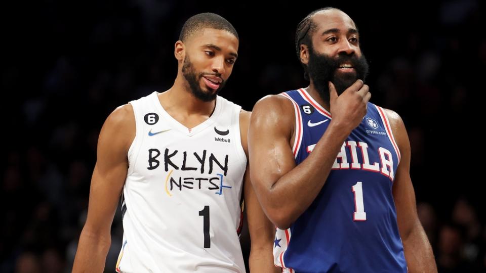 Feb 11, 2023; Brooklyn, New York, USA; Brooklyn Nets forward Mikal Bridges (1) talks to Philadelphia 76ers guard James Harden (1) during a time out during the third quarter at Barclays Center. Mandatory Credit: Brad Penner-USA TODAY Sports