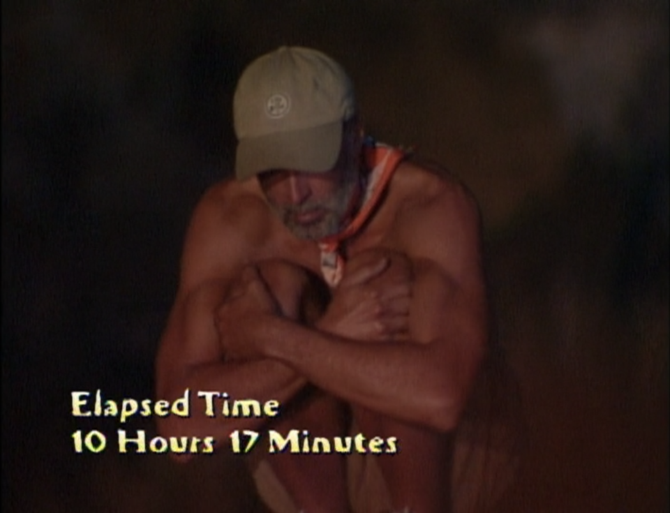 Keith Famie crouches on a pole for 10 hours and 17 minutes in Survivor: The Australian Outback