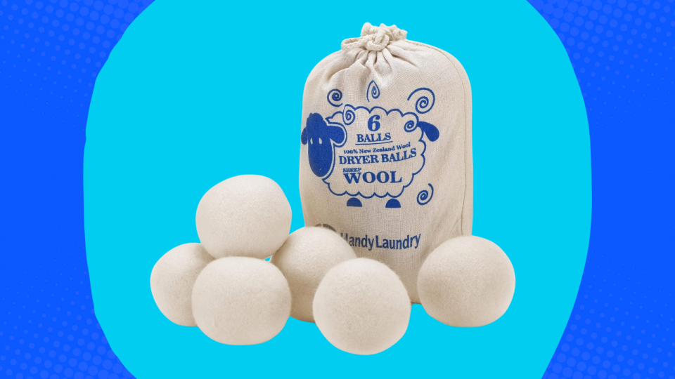 The wool dryer balls on a blue background