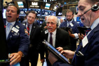 Traders work on the floor of the New York Stock Exchange (NYSE) in New York City, U.S., August 23, 2016. REUTERS/Brendan McDermid
