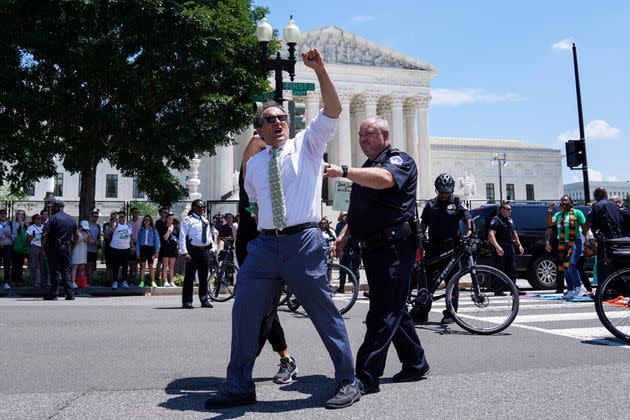 Rep. Andy Levin (D-Mich.) is seen being detained by police outside the U.S. Supreme Court during an abortion rights protest on Tuesday. (Photo: Sarah Silbiger via Reuters)