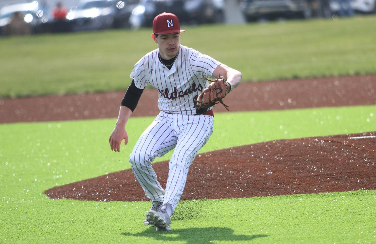 Newark's Cayden Vermilion fields a bouncer during the host Wildcats' 6-4 loss in eight innings to visiting Big Walnut in their season opener at Joe Neff Field on Monday, March 25, 2024.