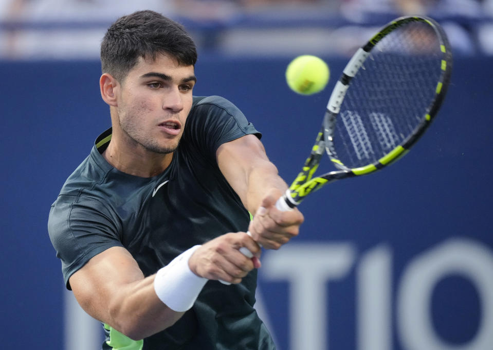 Spain's Carlos Alcaraz hits a backhand to Poland's Hubert Hurkacz during the National Bank Open men’s tennis tournament Thursday, Aug. 10, 2023, in Toronto. (Mark Blinch/The Canadian Press via AP)