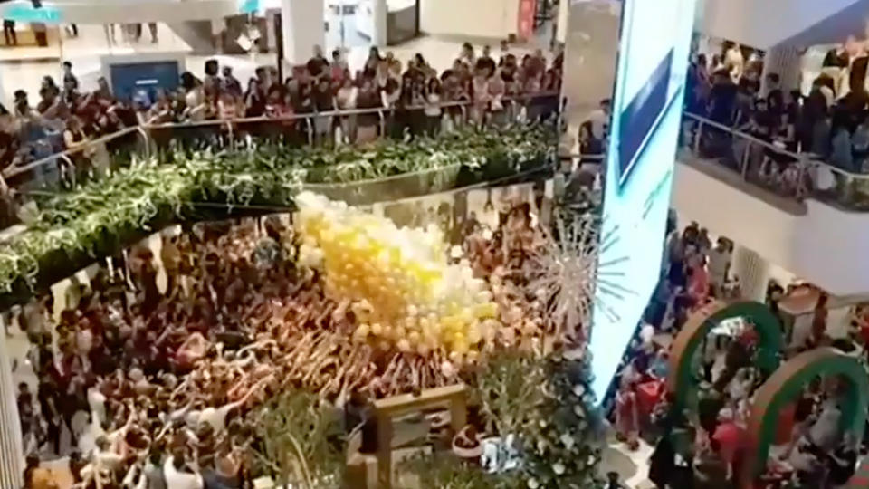 A crowd of shoppers at Westfield Parramatta during the mega balloon drop, which ended with five people were taken to hospital.