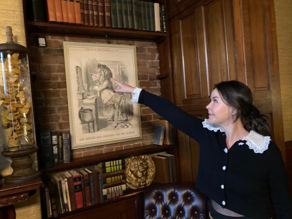 The Library Restaurant co-owner Adrienne Waterman points to the motion sensor detector inside the Portsmouth business Wednesday, Oct. 18, 2023.
