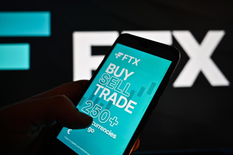 POLAND - 2023/01/18: In this photo illustration a FTX logo is displayed on a smartphone with stock market percentages on the background. (Photo Illustration by Omar Marques/SOPA Images/LightRocket via Getty Images)