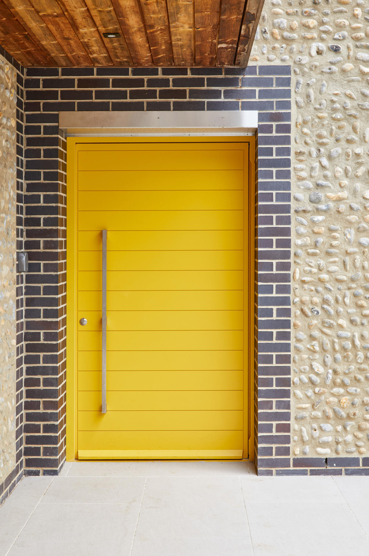 contemporary yellow front door from urban front