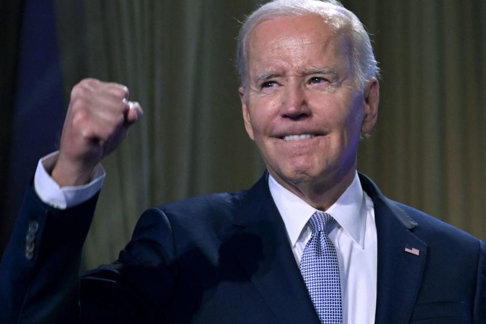 TOPSHOT - US President Joe Biden gestures on stage at the Washington Hilton in Washington, DC, April 25, 2023. - Biden announced Tuesday his bid 