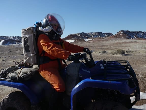 Crew 133 commander Paula Crock riding an all-terrain vehicle near Utah's Mars Desert Research Station, Jan. 15, 2014.