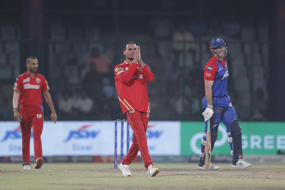 Panjab Kings' Rahul Chahar, center, celebrates the dismissal of Delhi Capitals' Mitchel Marsh, right, during the Indian Premier League cricket match between Delhi Capitals and Punjab Kings in New Delhi, India, Saturday, May 13, 2023. (AP Photo/Surjeet Yadav)