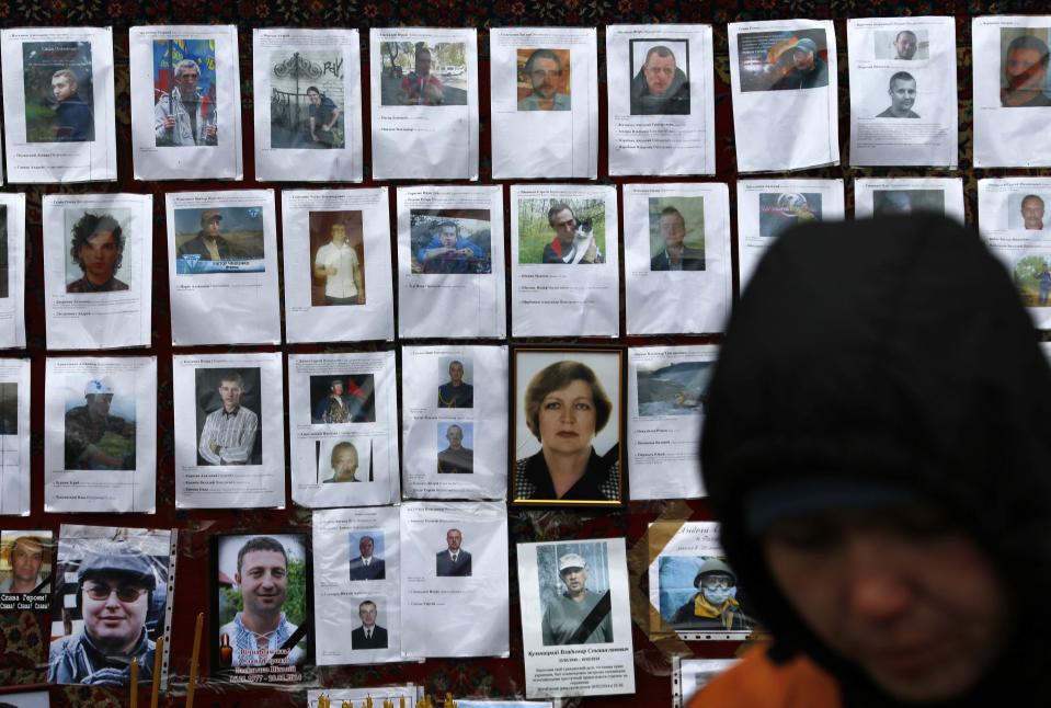 Photos of those killed in recent violence are seen at a make-shift memorial in Kiev's Independence square