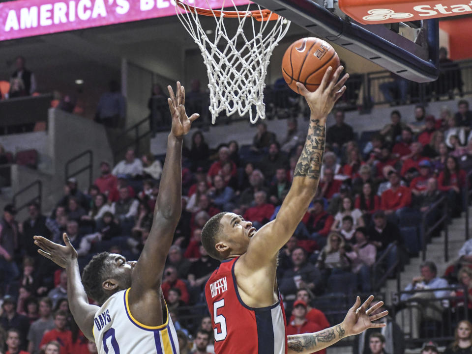 Mississippi forward KJ Buffen (5) is fouled by LSU forward Darius Days (0) during an NCAA college basketball game in Oxford, Miss., Saturday, Jan. 18, 2020. (Bruce Newman/The Oxford Eagle via AP)