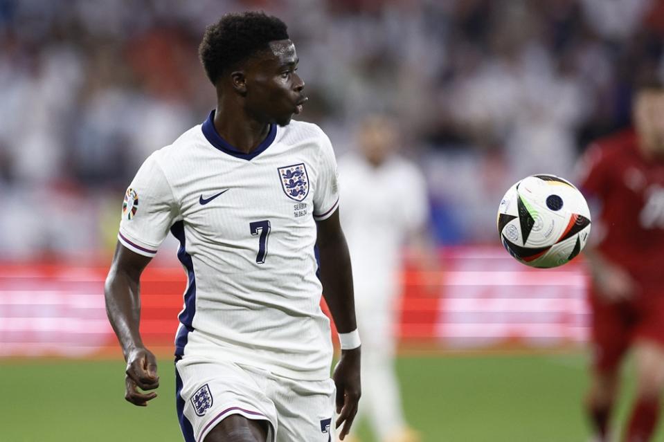 England's Bukayo Saka controls the ball during the UEFA Euro 2024 Group C football match between Serbia and England at the Arena AufSchalke in Gelsenkirchen on June 16, 2024. (Photo by KENZO TRIBOUILLARD/AFP via Getty Images)