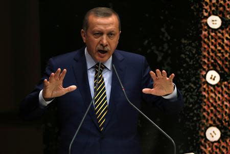 Turkey's Prime Minister Tayyip Erdogan addresses members of his ruling AK Party (AKP), during a meeting at party headquarters in Ankara December 25, 2013. REUTERS/Umit Bektas