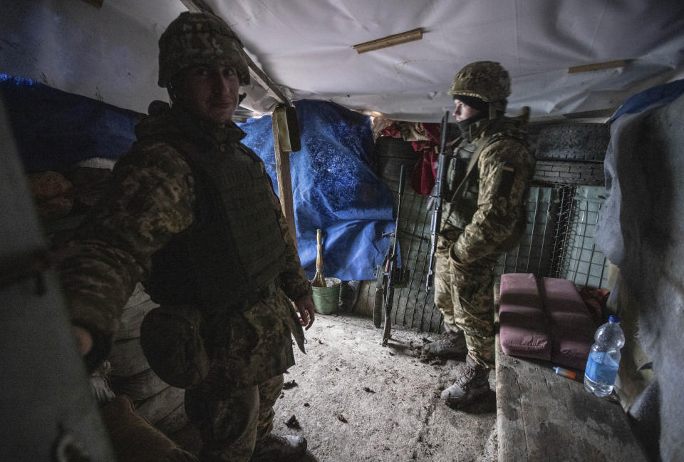 Ukrainian soldiers in a trench shelter on the line of separation from pro-Russian rebels, Mariupol, Donetsk region, Ukraine, Friday, Jan. 21, 2022. Blinken said the U.S. would be open to a meeting between Putin and U.S. President Joe Biden, if it would be “useful and productive.” The two have met once in person in Geneva and have had several virtual conversations on Ukraine that have proven largely inconclusive. Washington and its allies have repeatedly promised consequences such as biting economic sanctions against Russia — though not military action — if it invades. (AP Photo/Andriy Dubchak)