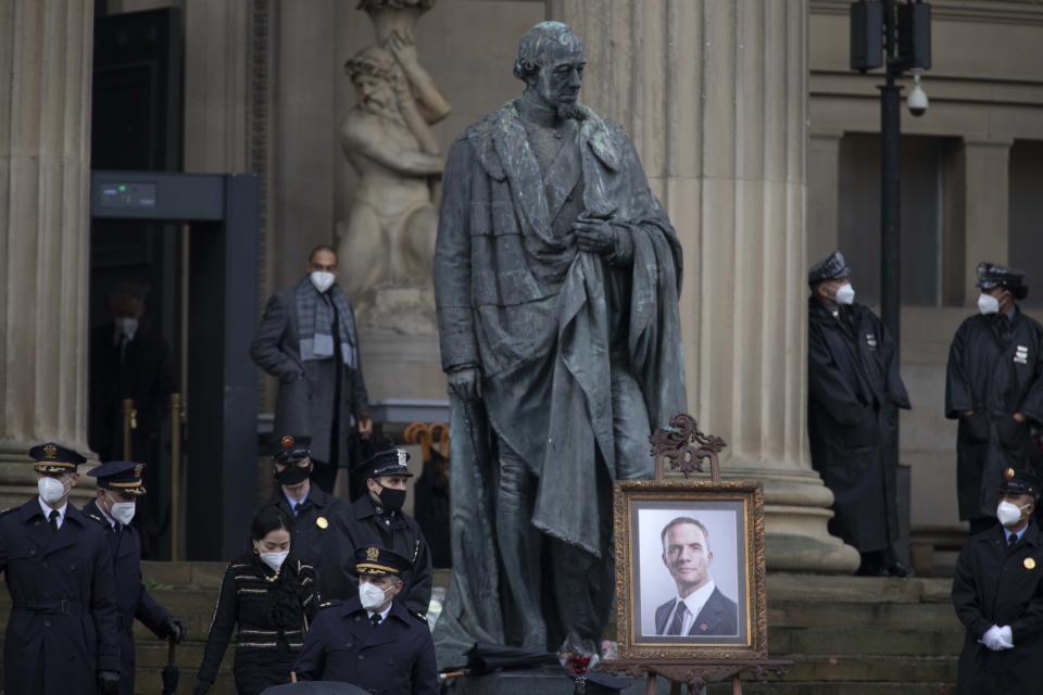 LIVERPOOL, ENGLAND - OCTOBER 12: Extras and actors wearing face masks outside St. George's Hall, during filming of The Batman movie, which commences this week, on October 12, 2020 in Liverpool, England. Filming for the reboot film in the Batman series, directed by Matt Reeves, began in January 2020 but was put on hold due to the Coronavirus Pandemic. It is now due for release in 2020 with Robert Pattinson playing Batman.  (Photo by Colin McPherson/Getty Images)