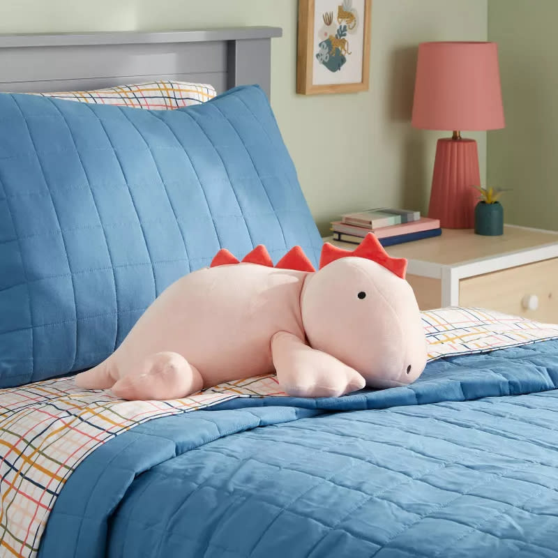 the dinosaur on a bed