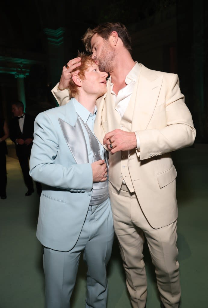 Ed Sheeran lived every girl’s dream — getting a smooch on the forehead from Hollywood hunk and gala co-chair Chris Hemsworth. Getty Images for The Met Museum/Vogue