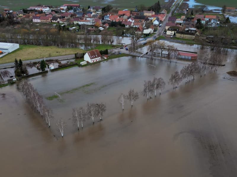 A general view of the flooded sports field in the village in the Mansfeld-Suedharz district. Jan Woitas/dpa