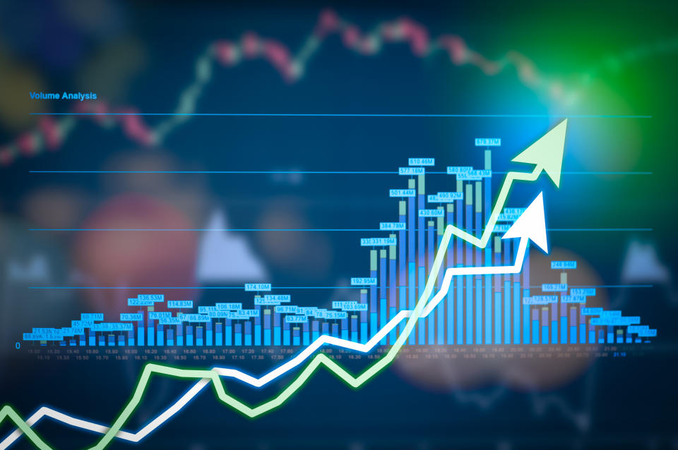 Stock market chart on colorful display indicating gains.