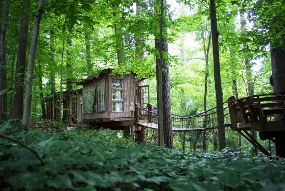 <p>Fulfill your childhood dreams with this forest fantasy in Atlanta, Georgia, which is one of the most popular Airbnb rentals of all time. The bedroom, living room, and deck are all connected by swinging rope bridges.</p><p><a class="link " href="https://www.airbnb.com/rooms/1415908" rel="nofollow noopener" target="_blank" data-ylk="slk:BOOK NOW;elm:context_link;itc:0;sec:content-canvas">BOOK NOW</a> <strong><em>Secluded Intown Treehouse</em></strong></p>