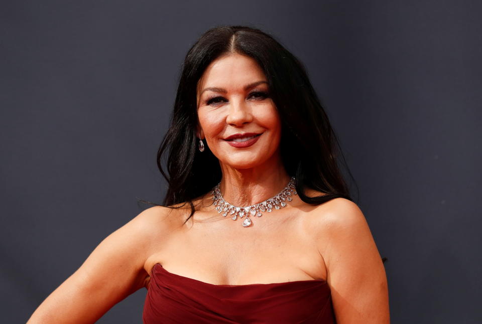 Actor Catherine Zeta-Jones arrives at the 73rd Primetime Emmy Awards in Los Angeles wearing a red strapless gown and a diamond necklace