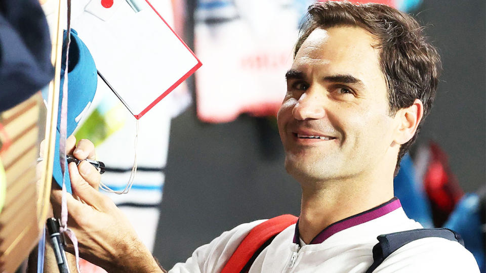 Roger Federer (pictured) signing autographs at the Australian Open.