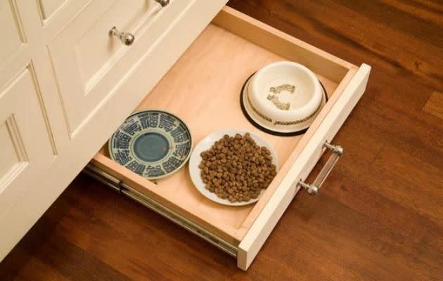 Source: Find a purpose for that annoying bottom draw and hide away your pet food that you don't want on display, win win. Source: Pinterest/houzz.com