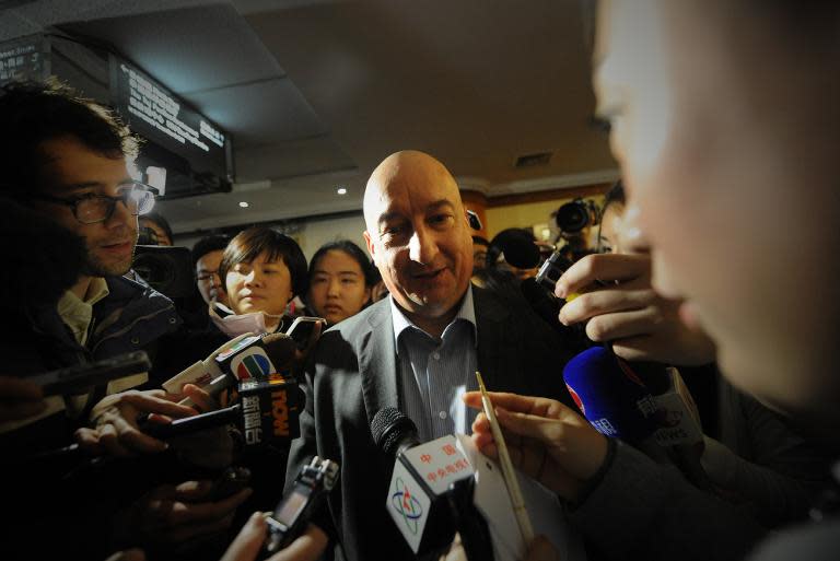 Commercial Director of Malaysia Airlines Hugh Dunleavy (C) speaks to the media at a hotel in Beijing on March 9, 2014