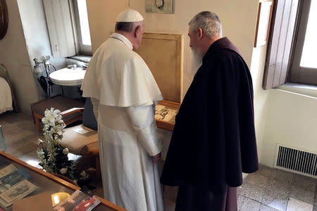 Pope Francis visits the cell of Saint Pio of Pietrelcina (Padre Pio) in San Giovanni Rotondo, Italy, March 17, 2018. Osservatore Romano/Handout via REUTERS